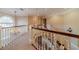 Bright upper hallway features hardwood floors and a stunning chandelier at 686 Newton Factory Bridge Rd, Covington, GA 30014