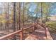 Wooden walkway leading through a lush wooded area at 686 Newton Factory Bridge Rd, Covington, GA 30014