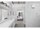 Modern bathroom with double vanity and view of bedroom at 800 Peachtree St # 1112, Atlanta, GA 30308