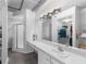 Bathroom with walk-in shower, double vanity and large mirror at 800 Peachtree St # 1112, Atlanta, GA 30308