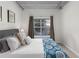 Bright bedroom with large window and ample closet space at 800 Peachtree St # 1112, Atlanta, GA 30308