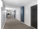 Building hallway with carpeted floors and access to units at 800 Peachtree St # 1112, Atlanta, GA 30308