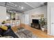 Living room with hardwood floors, exposed ductwork, and a comfy couch at 800 Peachtree St # 1112, Atlanta, GA 30308