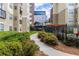 Landscaped pathway leading to community amenities at 800 Peachtree St # 1112, Atlanta, GA 30308