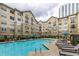 Inviting community pool with surrounding lounge chairs at 800 Peachtree St # 1112, Atlanta, GA 30308