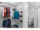 Spacious walk-in closet with wire shelving and hanging rods at 800 Peachtree St # 1112, Atlanta, GA 30308