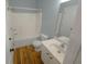 Clean bathroom with a shower/tub combo and wood-look flooring at 2372 Johnson Rd, Atlanta, GA 30345