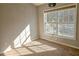 Bright bedroom with large window and neutral walls at 2372 Johnson Rd, Atlanta, GA 30345