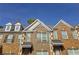 Brick townhouse exterior with dormers and shutters at 2372 Johnson Rd, Atlanta, GA 30345