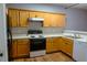 Kitchen with light wood cabinets and appliances at 2372 Johnson Rd, Atlanta, GA 30345