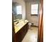 Bathroom with yellow vanity and toilet at 3174 Glen Hollow Dr, Rex, GA 30273