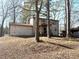 Two-story house with deck and wooded backyard at 3174 Glen Hollow Dr, Rex, GA 30273