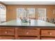 Kitchen island with a dark countertop and ample storage at 4955 R H Smith Blvd Blvd, Sugar Hill, GA 30518