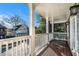 Covered balcony with wooden flooring and white railings at 683 Terry Se St, Atlanta, GA 30315