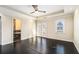 Bright bedroom with dark hardwood floors, private balcony, and ensuite bathroom at 683 Terry Se St, Atlanta, GA 30315