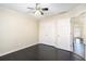 Well-lit bedroom with dark hardwood floors and ample closet space at 683 Terry Se St, Atlanta, GA 30315