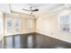 Well-lit bedroom with dark hardwood floors and a ceiling fan at 683 Terry Se St, Atlanta, GA 30315