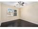 Bright bedroom featuring dark hardwood floors and a large window at 683 Terry Se St, Atlanta, GA 30315