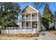 Two-story house with a front porch and white picket fence at 683 Terry Se St, Atlanta, GA 30315