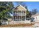 Two-story house with a front porch and white picket fence at 683 Terry Se St, Atlanta, GA 30315