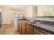 Kitchen with double sink, granite counters, and wood cabinets at 683 Terry Se St, Atlanta, GA 30315