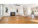 Hardwood floor living room with fireplace and staircase at 683 Terry Se St, Atlanta, GA 30315