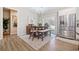 Bright dining area with hardwood floors and a wooden table at 754 Somersby Dr, Dallas, GA 30157