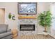 Modern electric fireplace with a gray stone surround at 754 Somersby Dr, Dallas, GA 30157