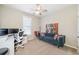 Bright home office features a comfortable sofa and a workspace with dual monitors at 754 Somersby Dr, Dallas, GA 30157