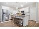 Kitchen island with granite countertop and four barstools at 754 Somersby Dr, Dallas, GA 30157