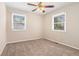 Cozy carpeted bedroom with ceiling fan and neutral wall color at 459 Oak Se Dr, Atlanta, GA 30354