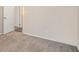 Carpeted bedroom with door to hallway and neutral walls at 459 Oak Se Dr, Atlanta, GA 30354