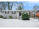 Gray brick ranch house with snowy front yard, steps, and landscaping at 459 Oak Se Dr, Atlanta, GA 30354