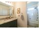 Bathroom boasts granite countertop and a shower/tub combo at 5274 Monarch Pine Ln, Peachtree Corners, GA 30071