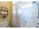 Clean bathroom with a shower/tub combo and white tile at 5274 Monarch Pine Ln, Peachtree Corners, GA 30071