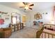 Light and airy Bedroom features a gold crib and built-in shelves at 5274 Monarch Pine Ln, Peachtree Corners, GA 30071