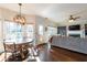 Bright dining area with hardwood floors and view into the living room and kitchen at 5274 Monarch Pine Ln, Peachtree Corners, GA 30071