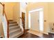 Two-story entryway with hardwood floors and staircase at 5274 Monarch Pine Ln, Peachtree Corners, GA 30071