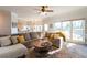 Relaxing living room with hardwood floors, large windows, and comfortable sectional sofa at 5274 Monarch Pine Ln, Peachtree Corners, GA 30071