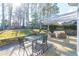 Outdoor patio with dining area, comfortable seating, and pergola at 5274 Monarch Pine Ln, Peachtree Corners, GA 30071