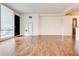 Hardwood floor living room with access to balcony at 620 Peachtree Ne St # 415, Atlanta, GA 30308