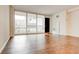 Bright living room with hardwood floors and large windows at 620 Peachtree Ne St # 415, Atlanta, GA 30308