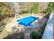 Overhead view of a refreshing pool, slide, and diving board at 6204 Woodlore Nw Dr, Acworth, GA 30101