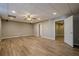 Finished basement with LVP flooring and ceiling fan at 6204 Woodlore Nw Dr, Acworth, GA 30101