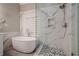 Elegant bathroom with a large soaking tub, walk-in shower, and marble tile at 6204 Woodlore Nw Dr, Acworth, GA 30101