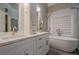 Elegant bathroom with double vanity, soaking tub, and marble accents at 6204 Woodlore Nw Dr, Acworth, GA 30101