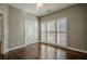 Well-lit bedroom with hardwood floors and double closets at 6204 Woodlore Nw Dr, Acworth, GA 30101