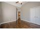 Bedroom with hardwood floors, ceiling fan and access to bathroom at 6204 Woodlore Nw Dr, Acworth, GA 30101