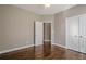 Spacious bedroom featuring hardwood floors and ample closet space at 6204 Woodlore Nw Dr, Acworth, GA 30101