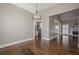 Dining room with hardwood floors and kitchen access at 6204 Woodlore Nw Dr, Acworth, GA 30101